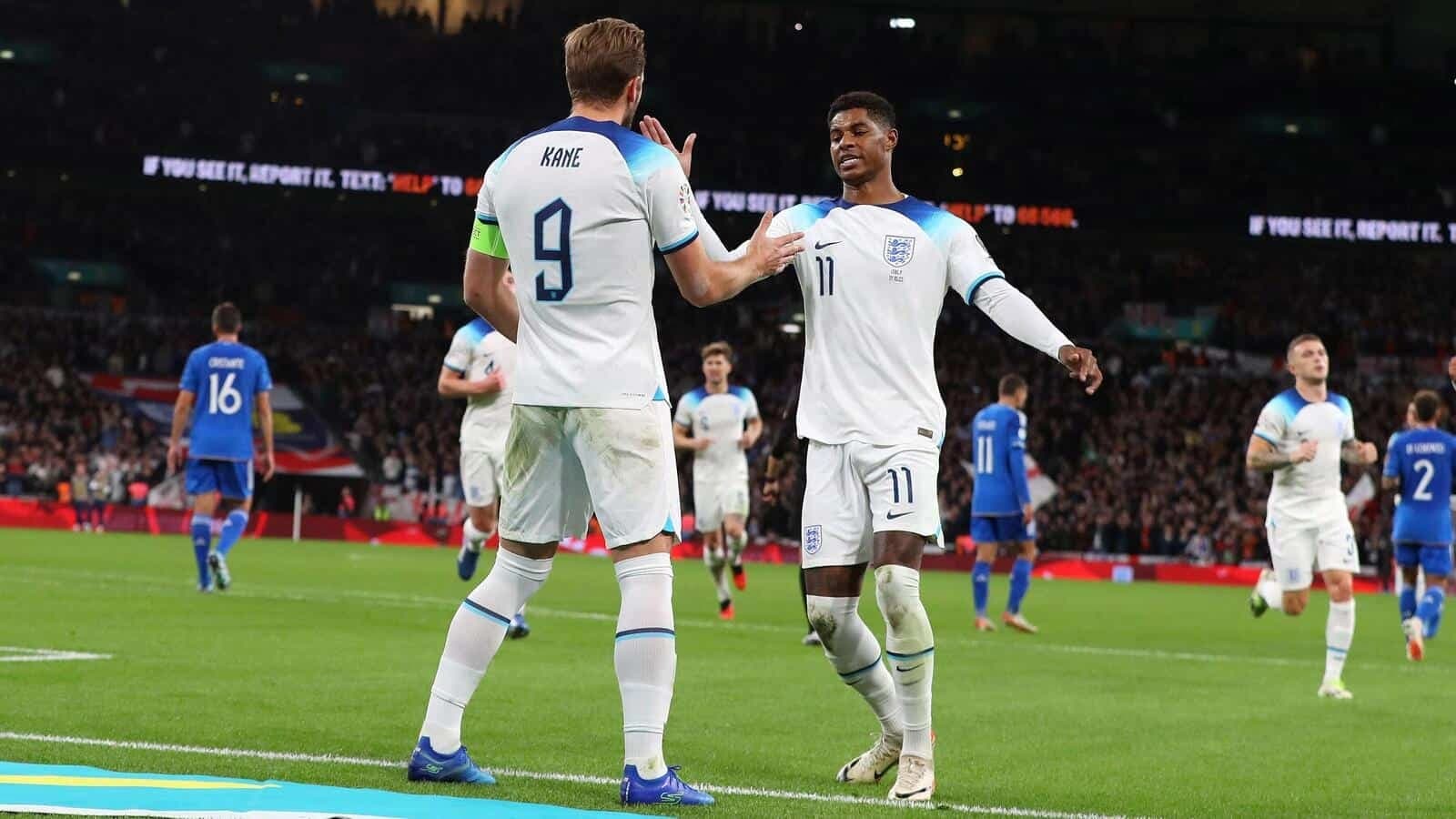 Harry Kane of England celebrates with Marcus Rashford