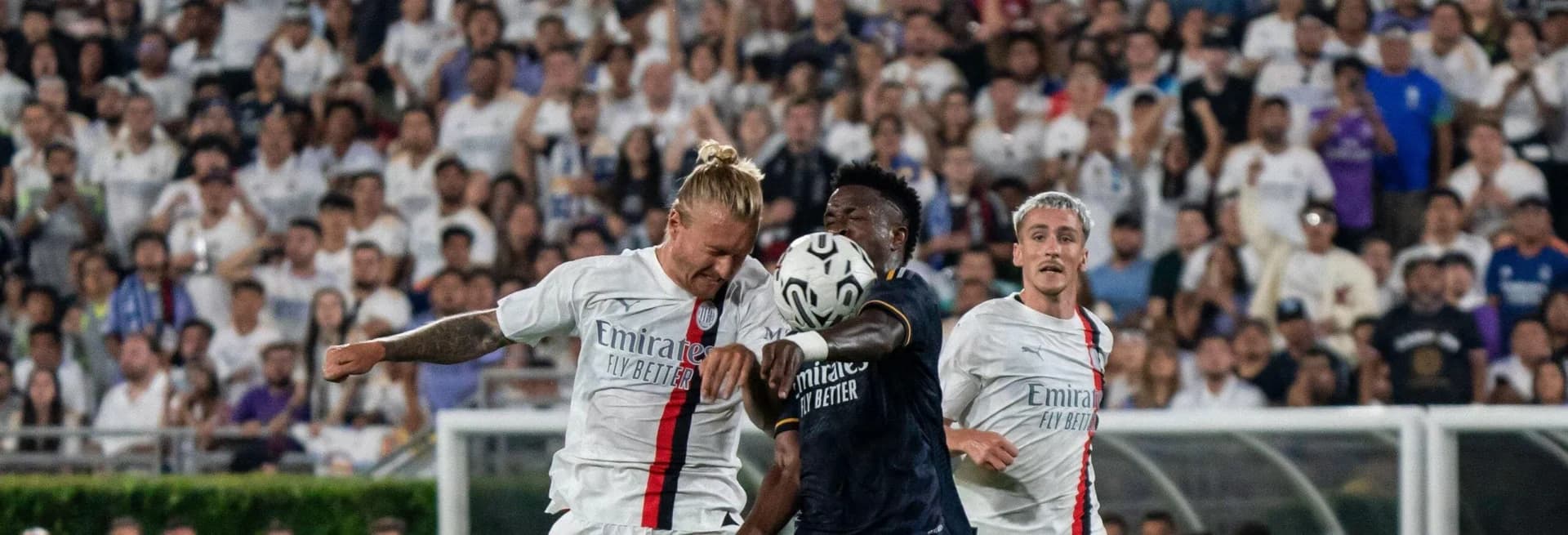 Vinicius Jr battles against PSG players in a Champions League match