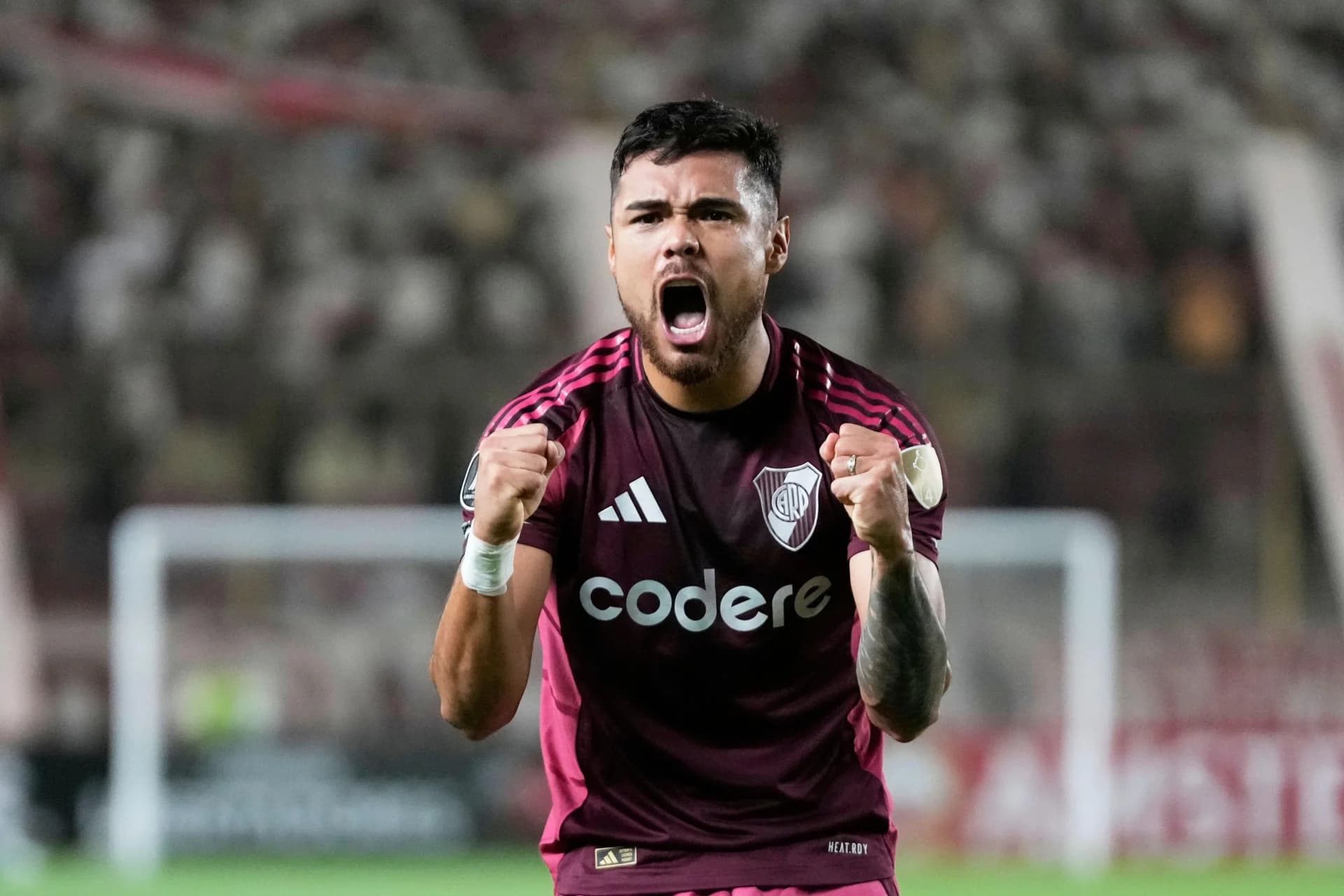 Paulo Diaz of Argentina's River Plate celebrates scoring his side's opening goal against Peru's Universitario de Deportes during a Copa Libertadores Group B soccer match in Lima, Peru, Wednesday, April 2, 2025. (AP Photo/Martin Mejia)