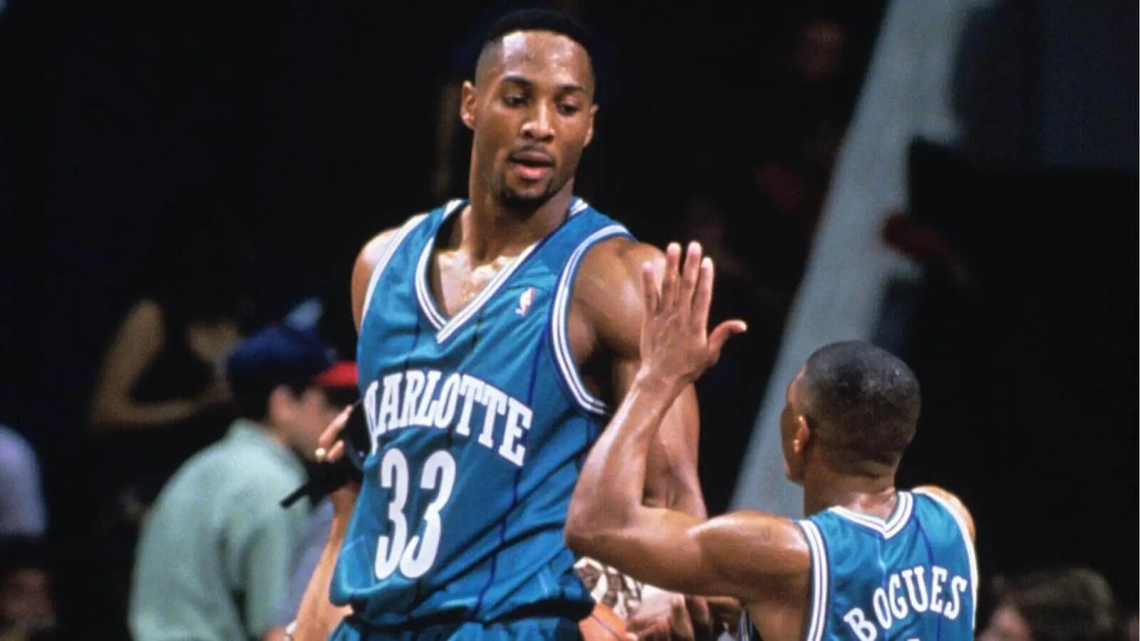 Alonzo Mourning (33) and guard Mugsy Bogues (1) of the Charlotte Hornets