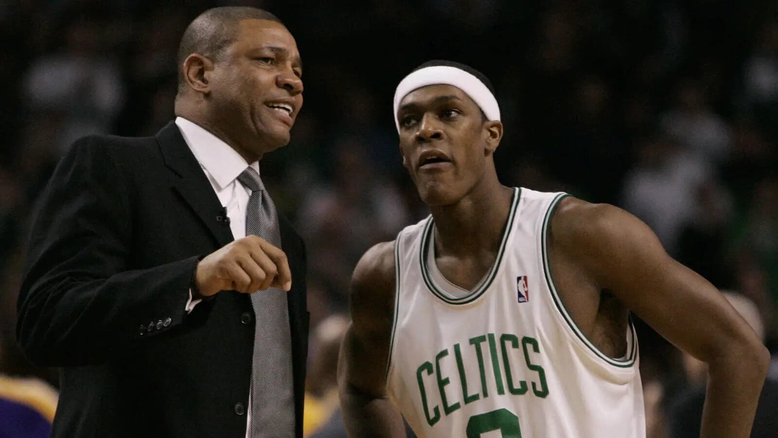 Boston Celtics coach Glenn 'Doc' Rivers chats with guard Rajon Rondo