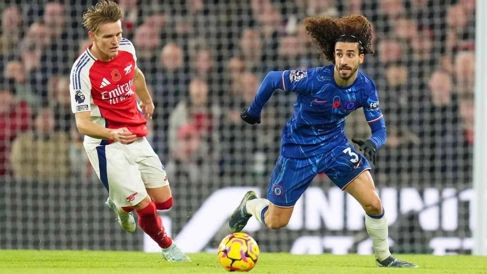 Chelsea's Marc Cucurella runs with the ball watched by Arsenal's Martin Odegaard
