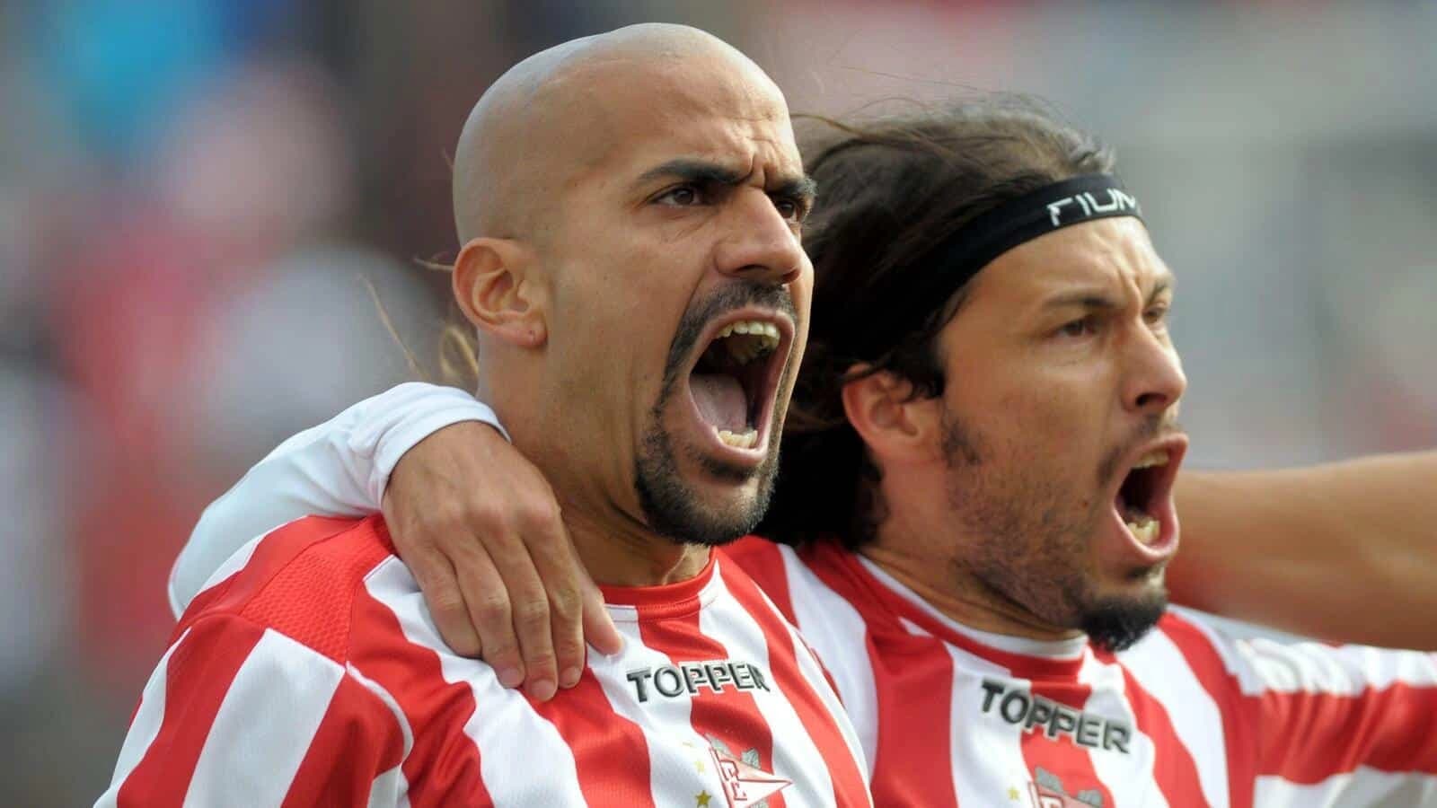 Estudiantes de la La Plata's Juan Sebastian Veron, left, celebrates with teammate Ivan Moreno after scoring