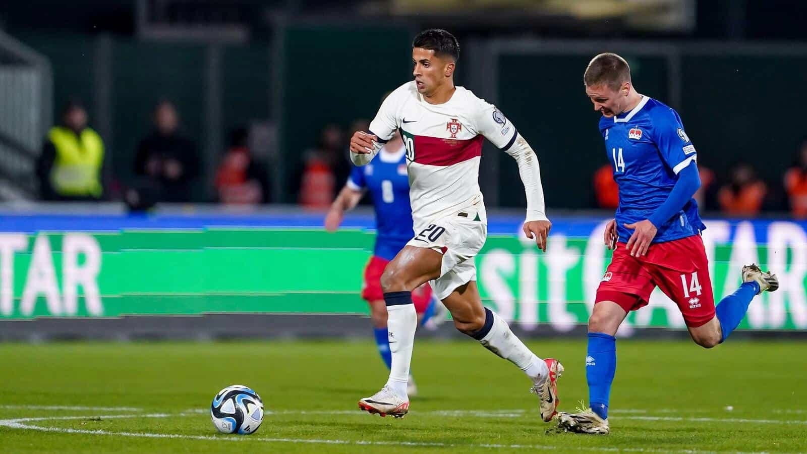 Joao Cancelo (20 Portugal) and Livio Meier (14 Liechtenstein) battle for the ball