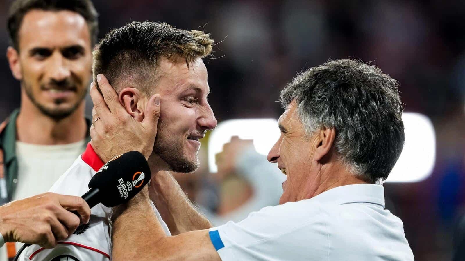 Jose' Luis Mendilibar manager of Sevilla FC celebrates with Ivan Rakitic of Sevilla FC